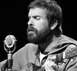 Singing guitar player