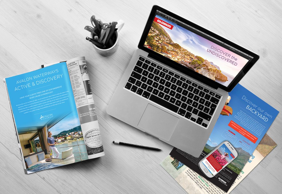 Portfolio page Hero image showing a variety of promotional materials set on a desk